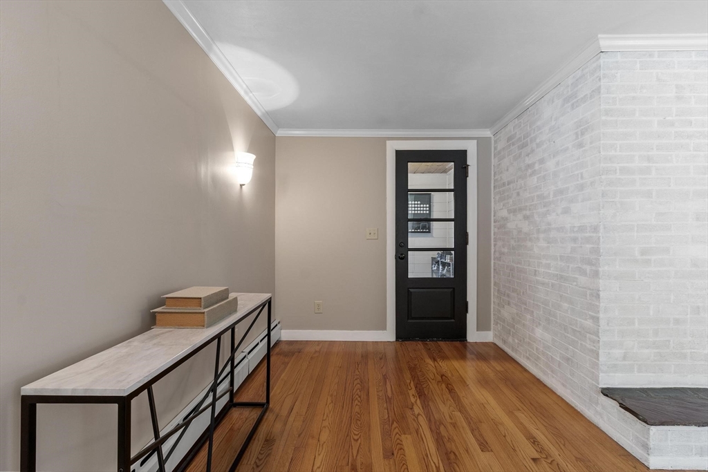 167 Gates Pond Road Berlin, MA 01503 - Photo 5 of 32 a view of a hallway with wooden floor and entryway