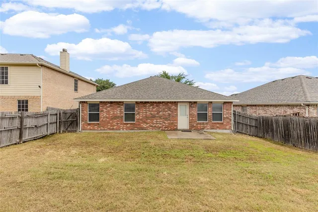 a house with swimming pool in front of it