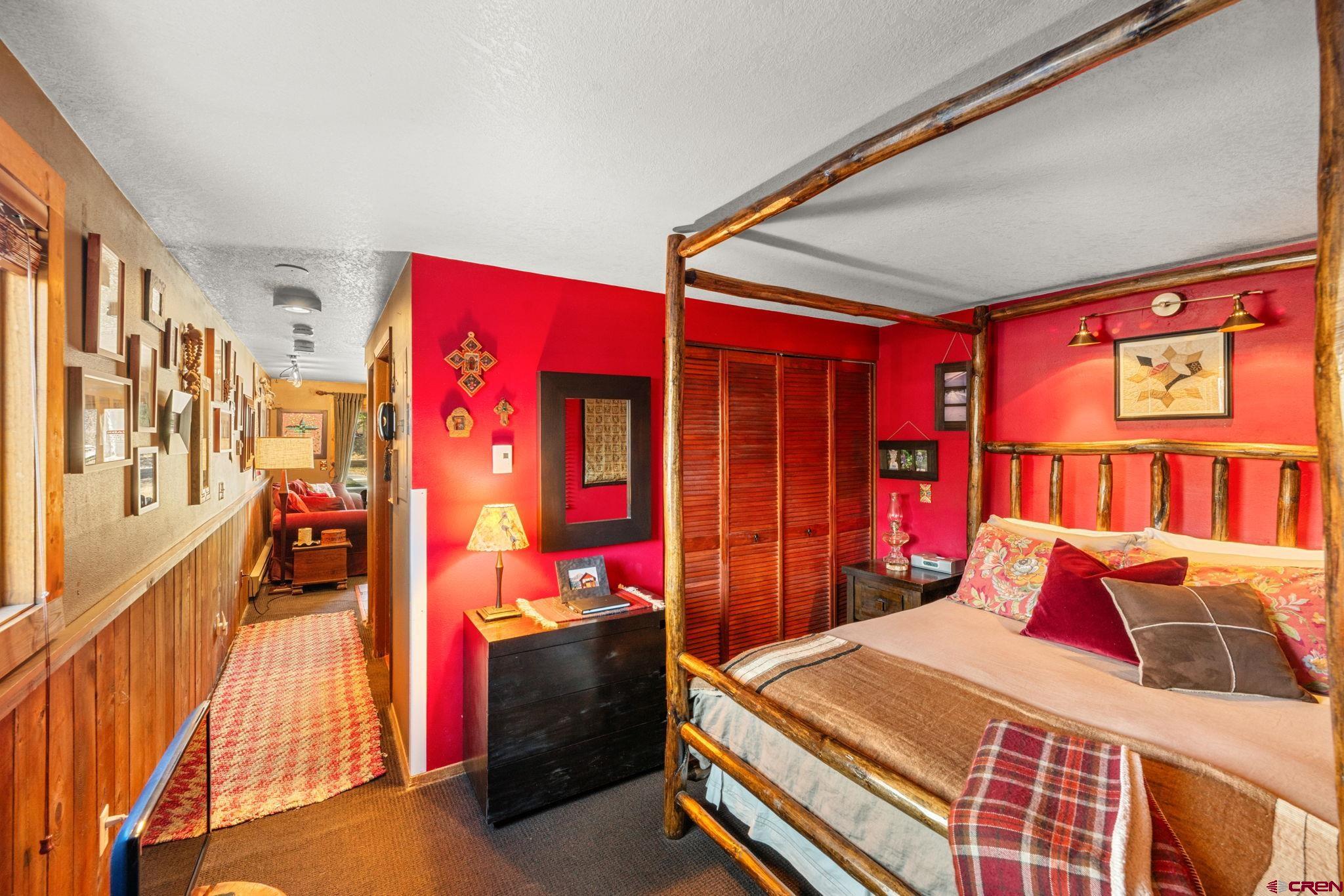 701 Gothic Road, Unit 143 Crested Butte, CO 81225 - Photo 12 of 30 a bed room with a bed and a closet