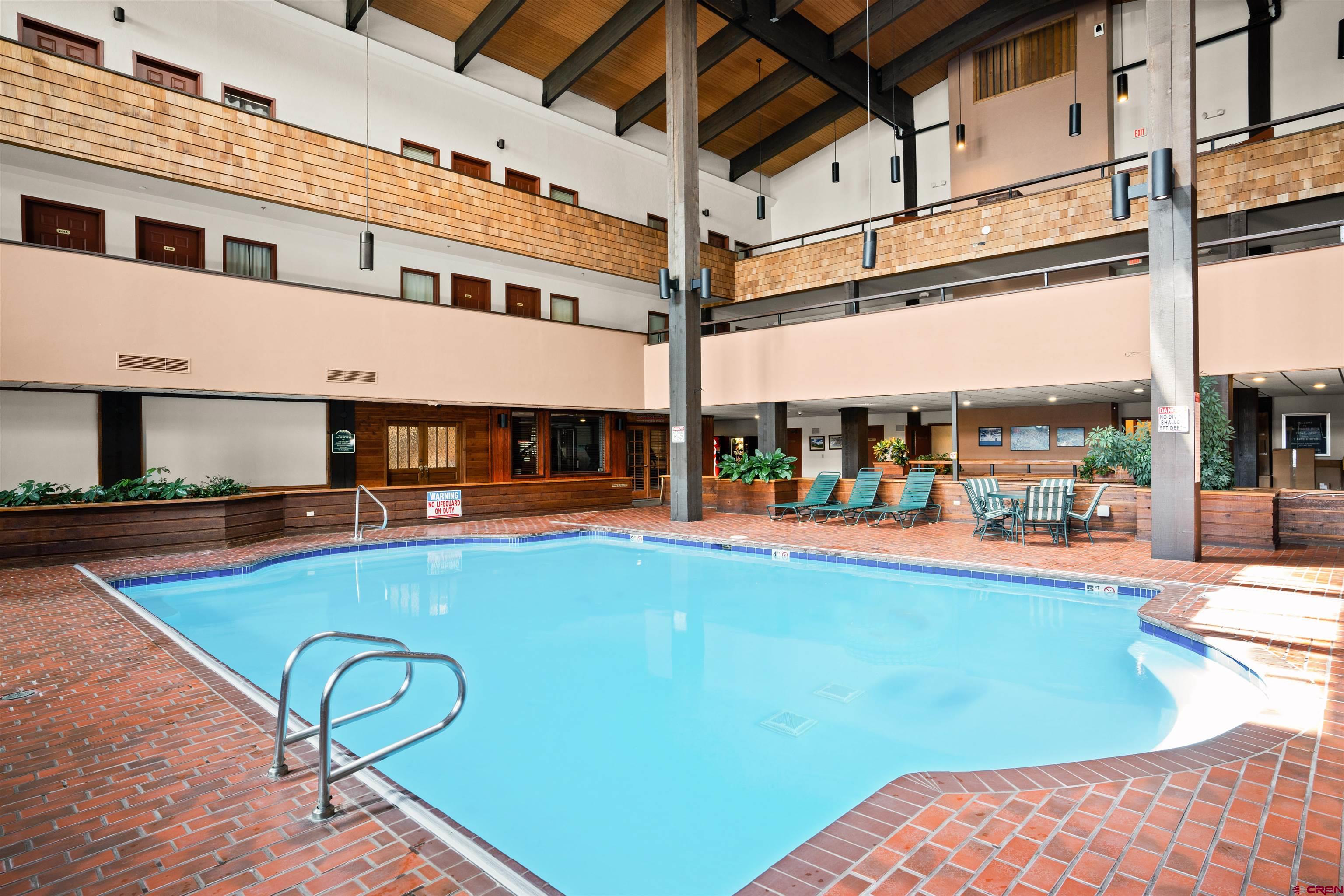 701 Gothic Road, Unit 143 Crested Butte, CO 81225 - Photo 14 of 30 a view of a swimming pool with outdoor seating
