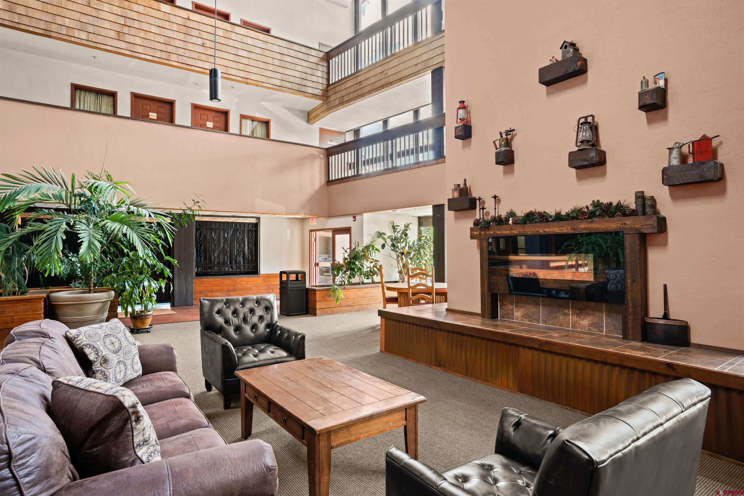 701 Gothic Road, Unit 143 Crested Butte, CO 81225 - Photo 16 of 30 a living room with furniture and a potted plant
