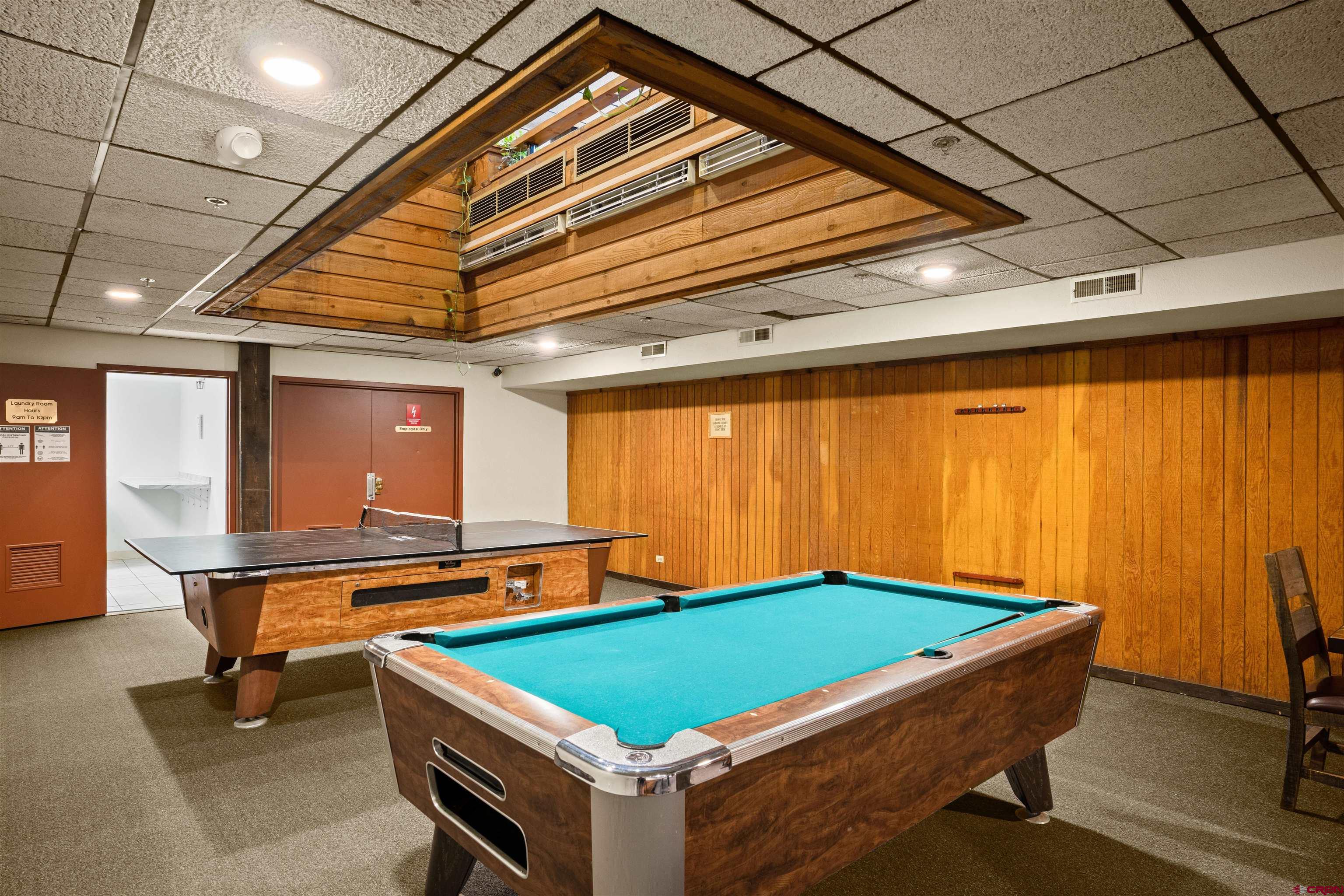 701 Gothic Road, Unit 143 Crested Butte, CO 81225 - Photo 17 of 30 a room with pool table and glass windows