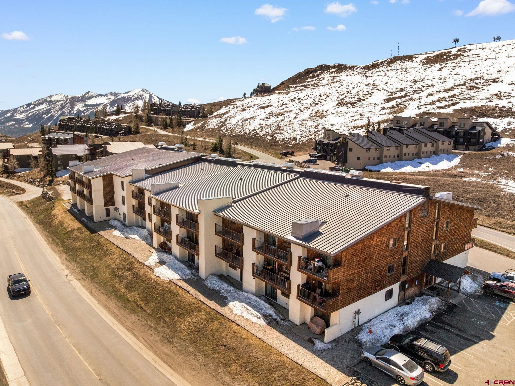 701 Gothic Road, Unit 143 Crested Butte, CO 81225 - Photo 23 of 30 a view of a large building with a mountain
