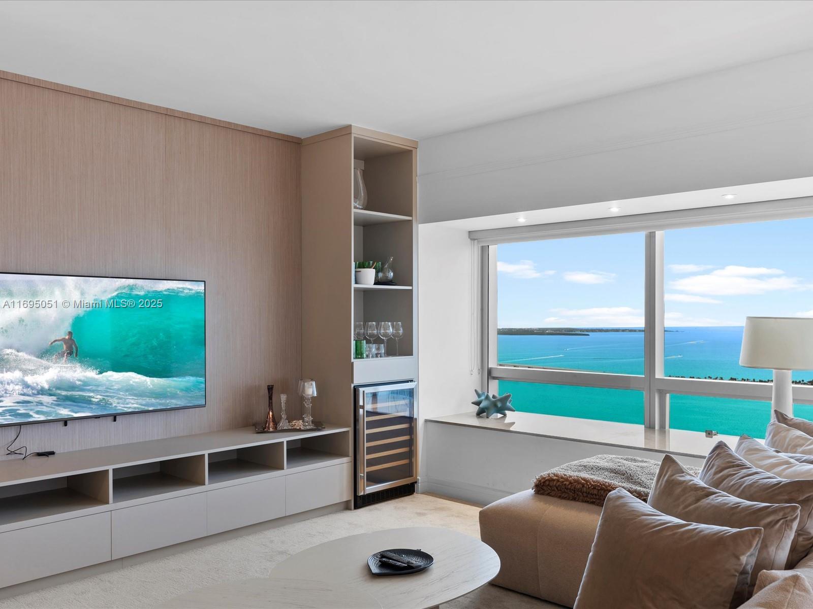 1435 Brickell Avenue, Unit 3601 Miami, FL 33131 - Photo 11 of 42 a room with furniture and a flat screen tv