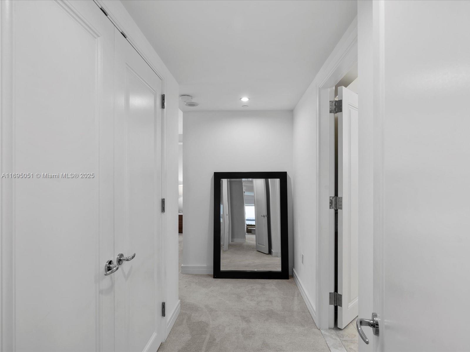 1435 Brickell Avenue, Unit 3601 Miami, FL 33131 - Photo 20 of 42 a view of a hallway with wooden shelves