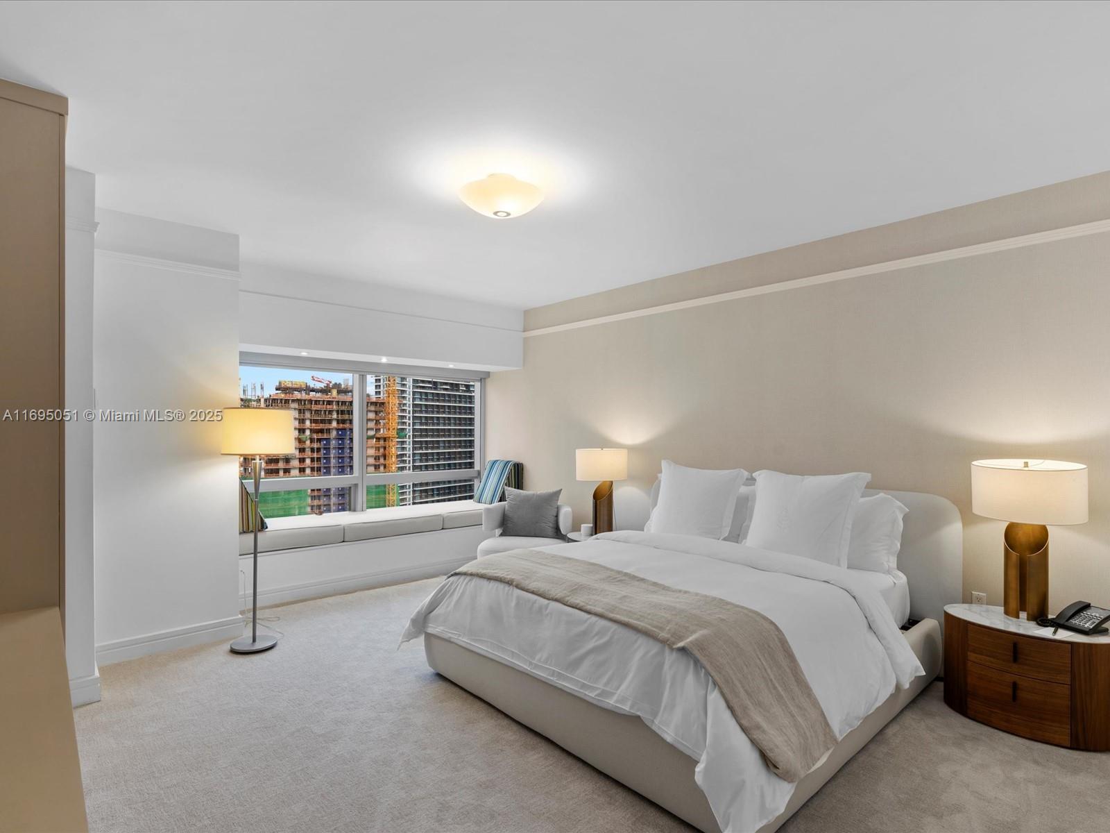 1435 Brickell Avenue, Unit 3601 Miami, FL 33131 - Photo 21 of 42 a bedroom with a bed and a couch