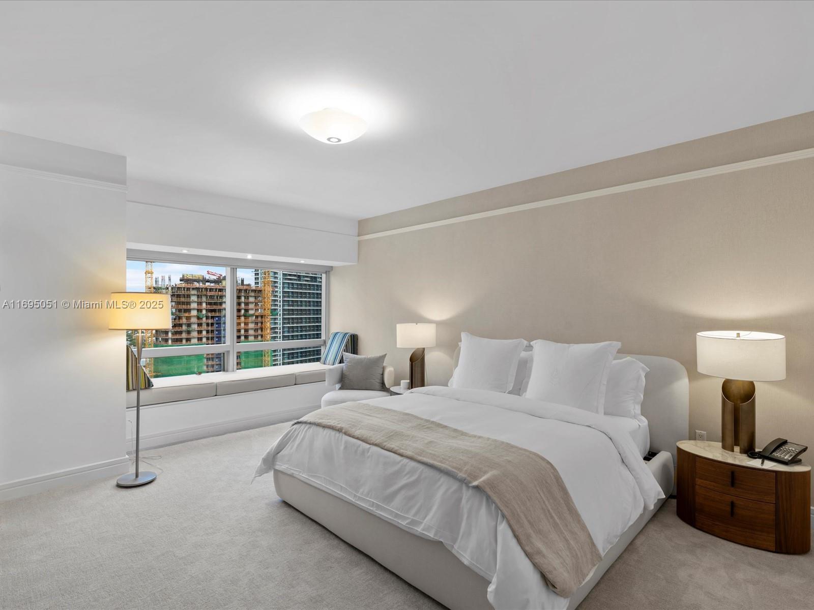 1435 Brickell Avenue, Unit 3601 Miami, FL 33131 - Photo 22 of 42 a spacious bedroom with a bed and a large window