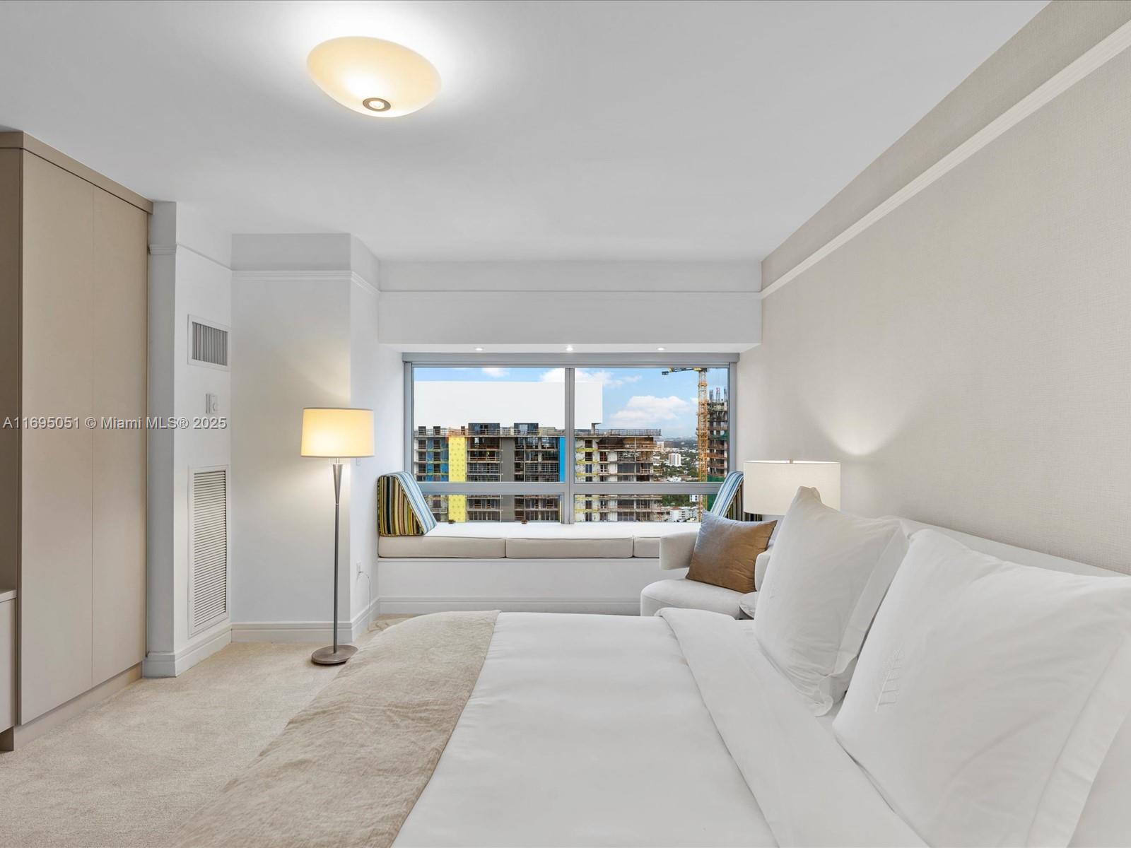 1435 Brickell Avenue, Unit 3601 Miami, FL 33131 - Photo 24 of 42 a living room with furniture and a large window