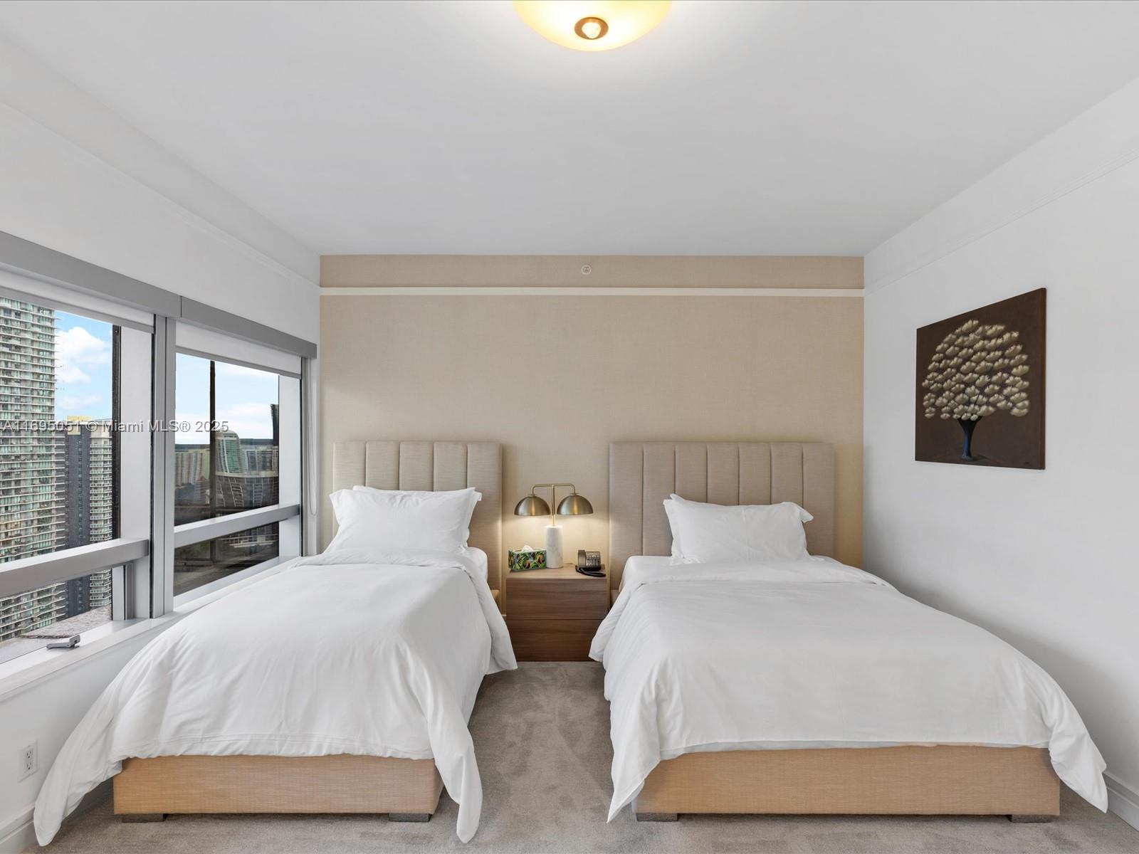 1435 Brickell Avenue, Unit 3601 Miami, FL 33131 - Photo 32 of 42 a bedroom with double bed and a large window