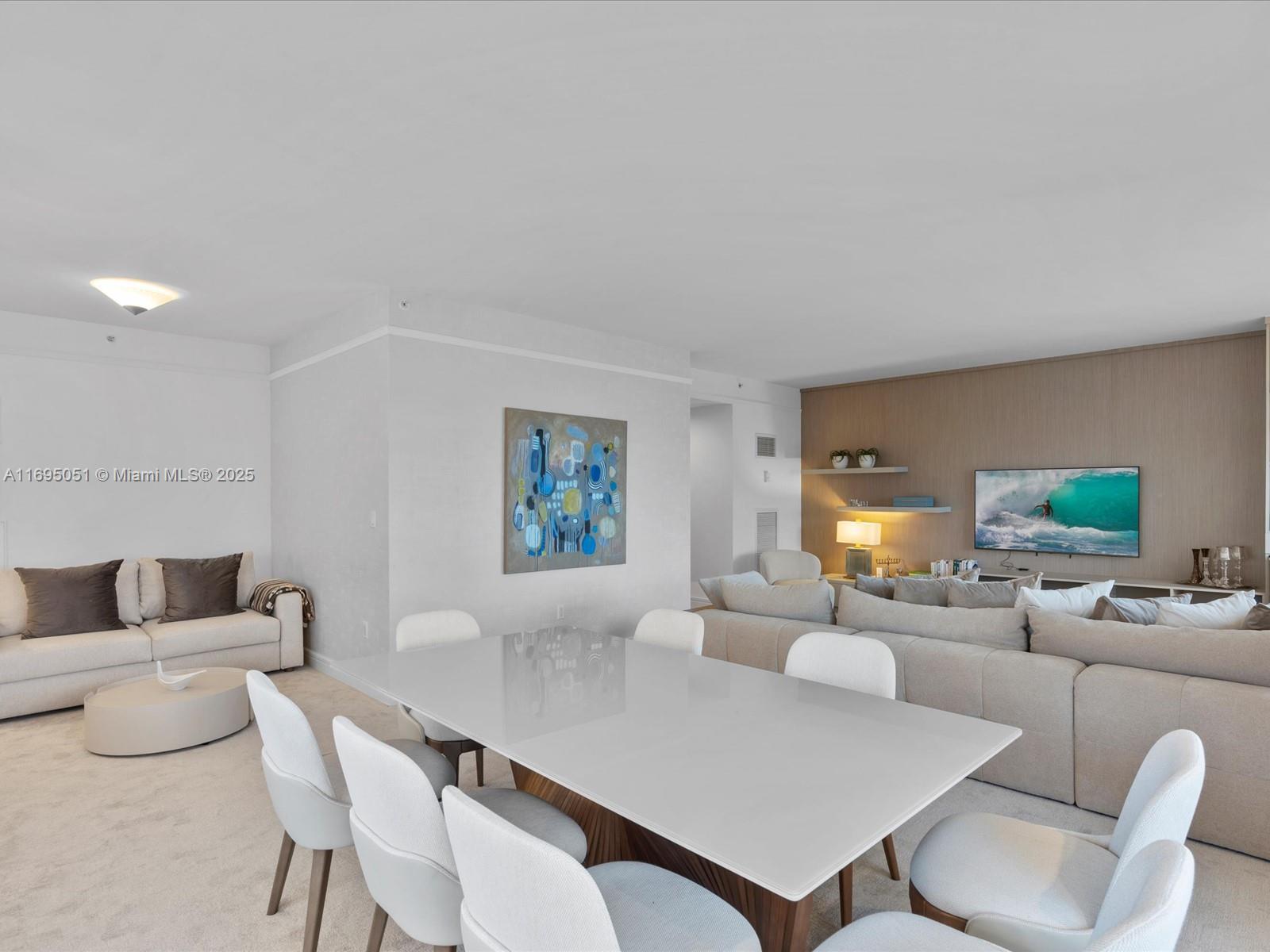 1435 Brickell Avenue, Unit 3601 Miami, FL 33131 - Photo 5 of 42 a living room with furniture and a table