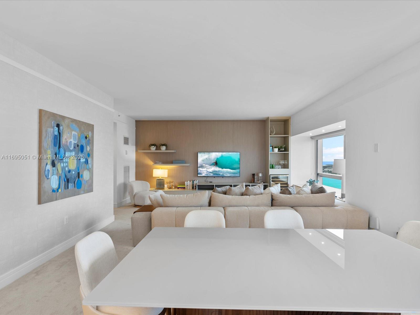 1435 Brickell Avenue, Unit 3601 Miami, FL 33131 - Photo 6 of 42 a living room with furniture and a flat screen tv