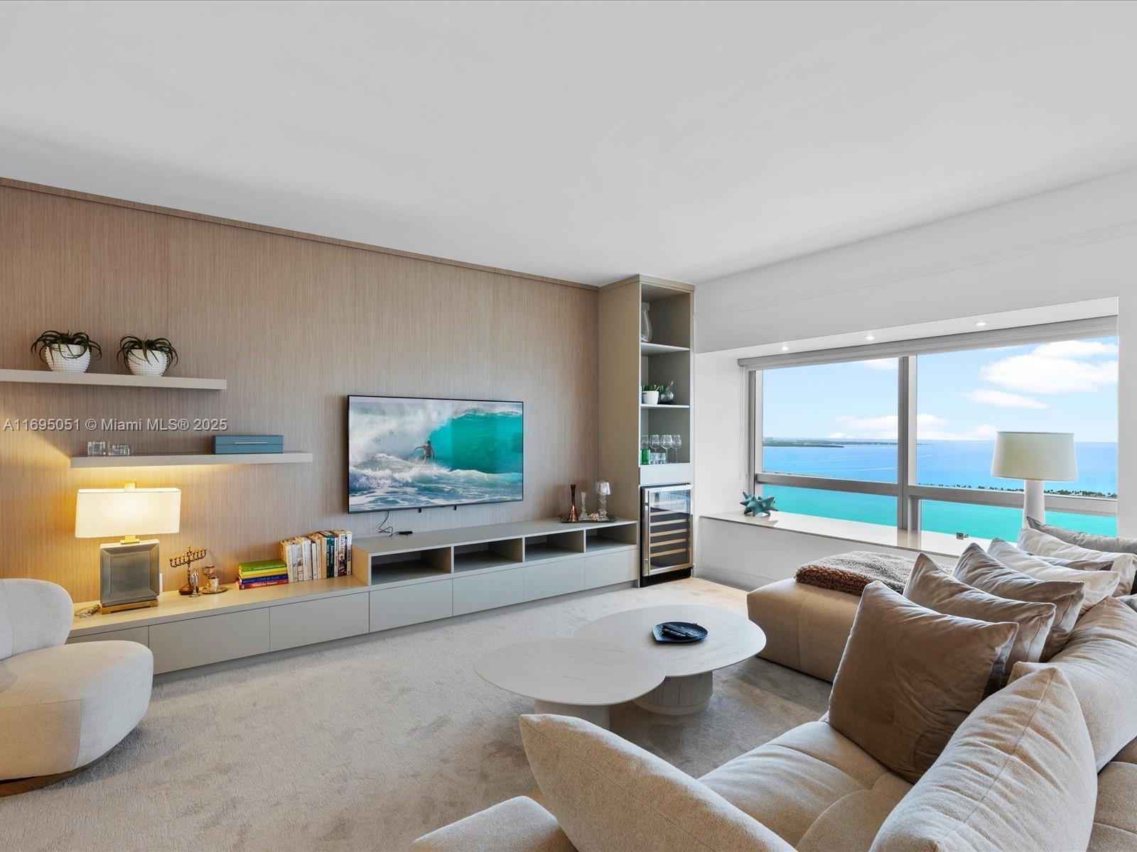 1435 Brickell Avenue, Unit 3601 Miami, FL 33131 - Photo 10 of 42 a living room with furniture and a large window