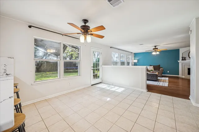 a view of a kitchen with furniture and a large window