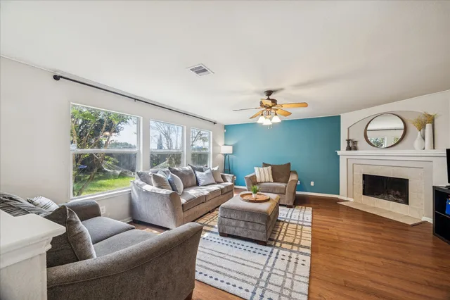 a living room with furniture and a fireplace