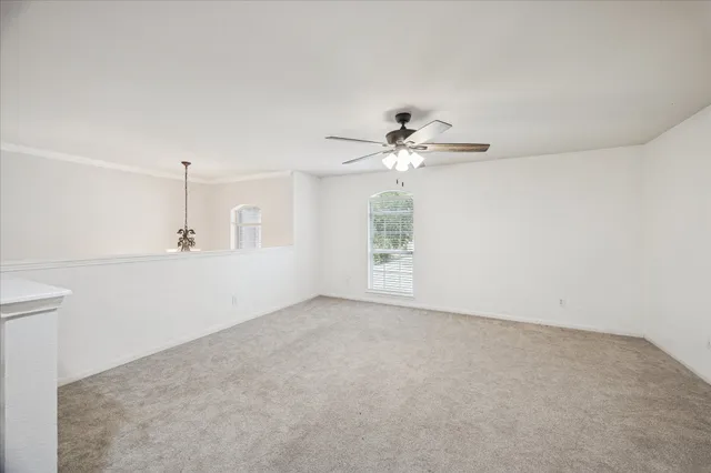 a white toilet sitting next to a white sink