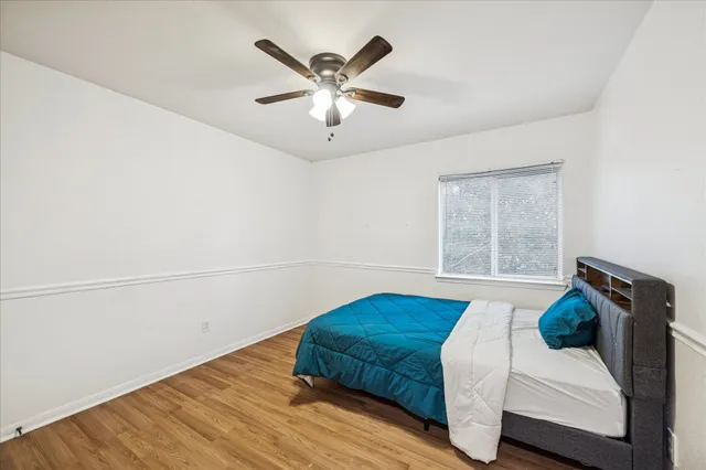 a bathroom with a double vanity sink a mirror and a shower