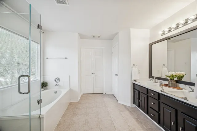 a en suite bathroom with a sink and a mirror