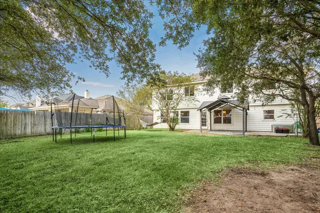 a white bath tub sitting next to a shower