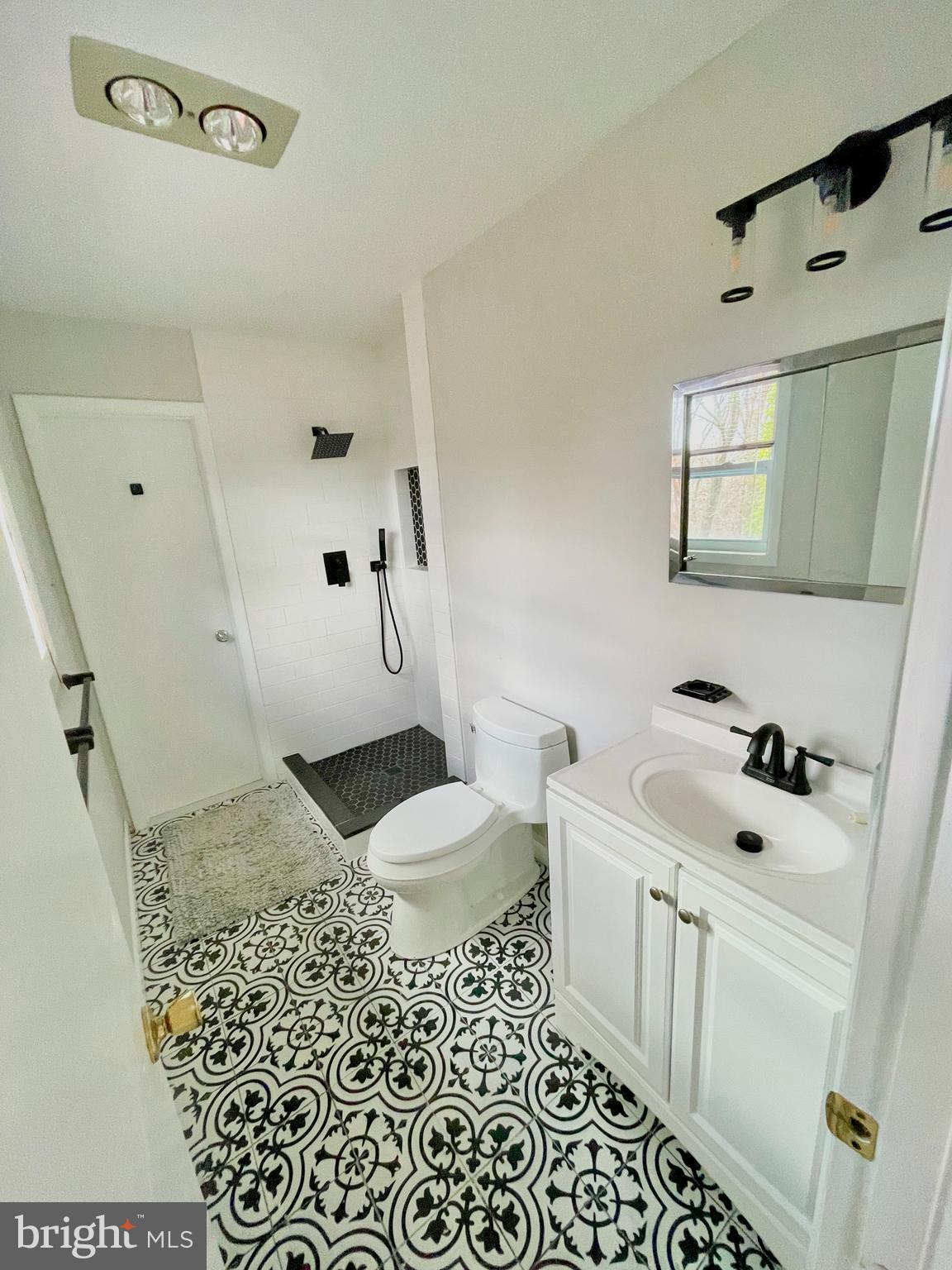 403 Merryman Road Annapolis, MD 21401 - Photo 12 of 31 a bathroom with a sink toilet and shower