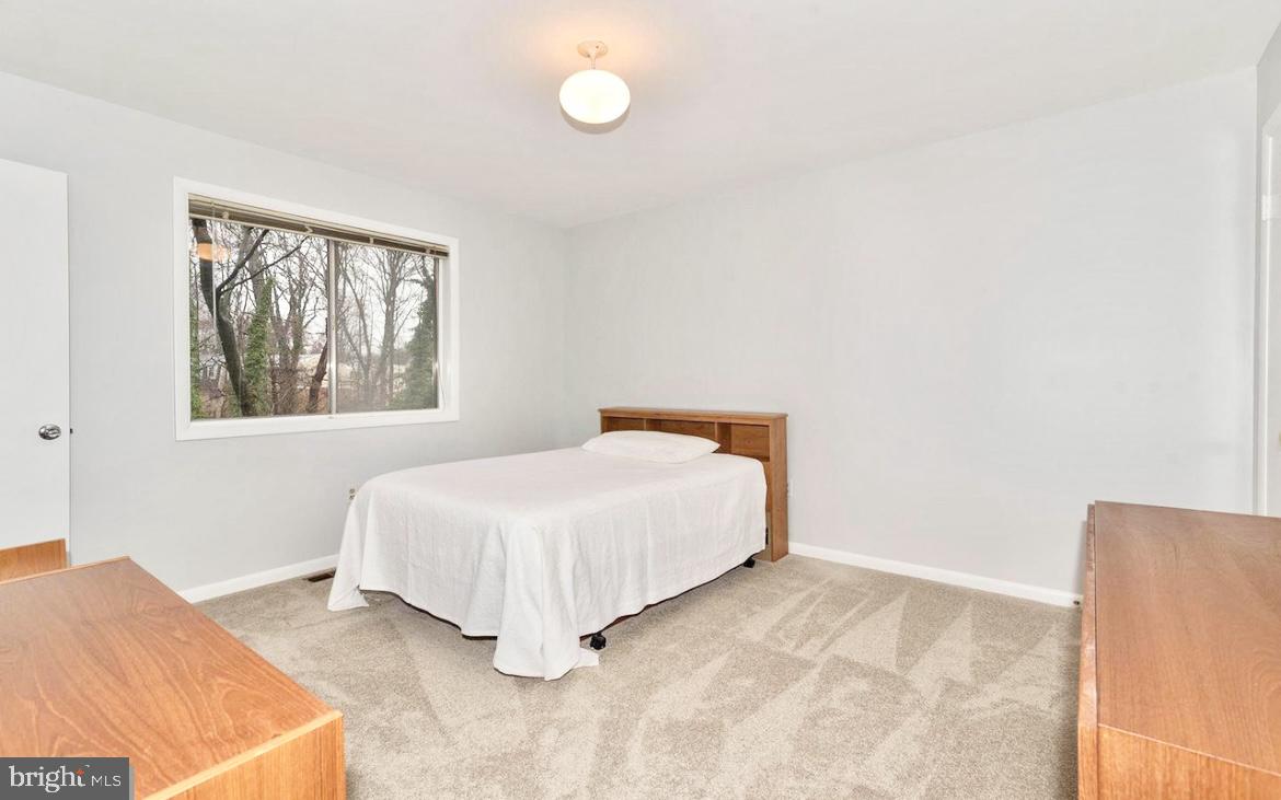 403 Merryman Road Annapolis, MD 21401 - Photo 13 of 31 a bedroom with a bed and a window