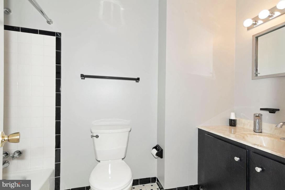 403 Merryman Road Annapolis, MD 21401 - Photo 16 of 31 a bathroom with a toilet sink and mirror