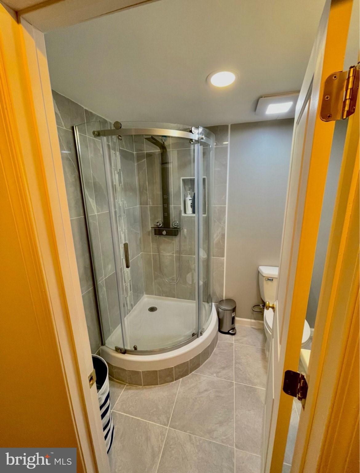 403 Merryman Road Annapolis, MD 21401 - Photo 20 of 31 a bathroom with a tub and a shower