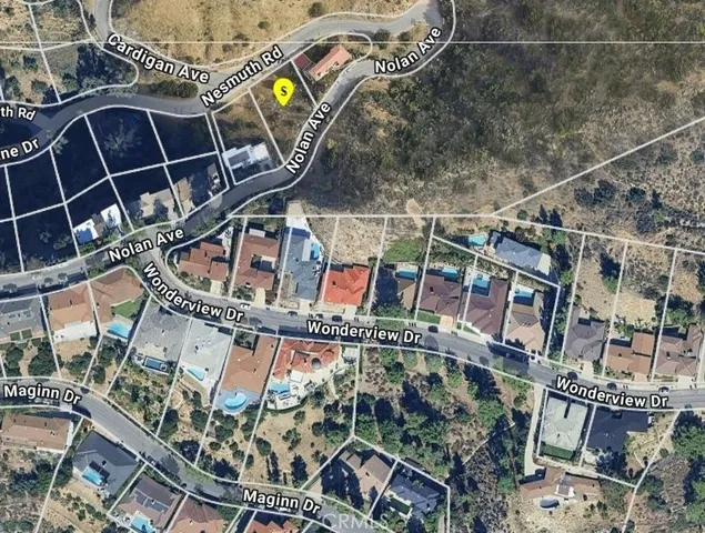 a view of a backyard of the house