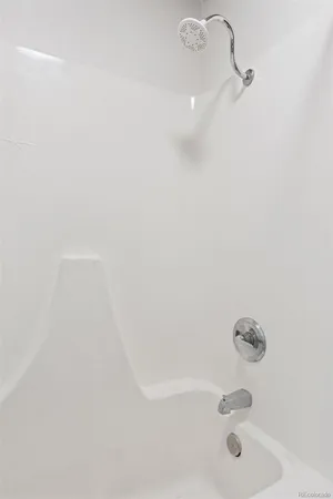 a bedroom with a bed and a table