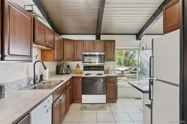 a kitchen with a sink and a stove