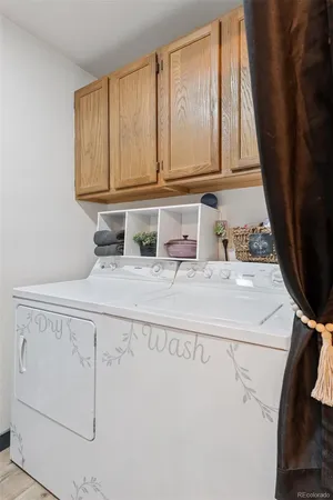 a view of a house with a backyard and a tree