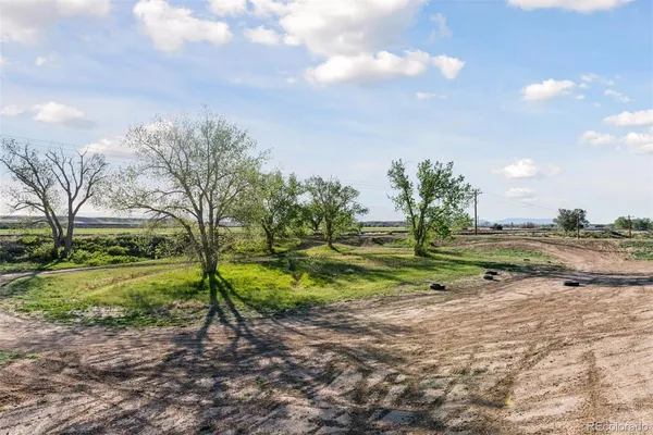 a view of a lake with an outdoor seating