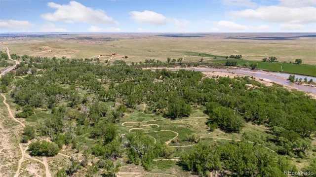 a bedroom with a bed and a flat tv screen