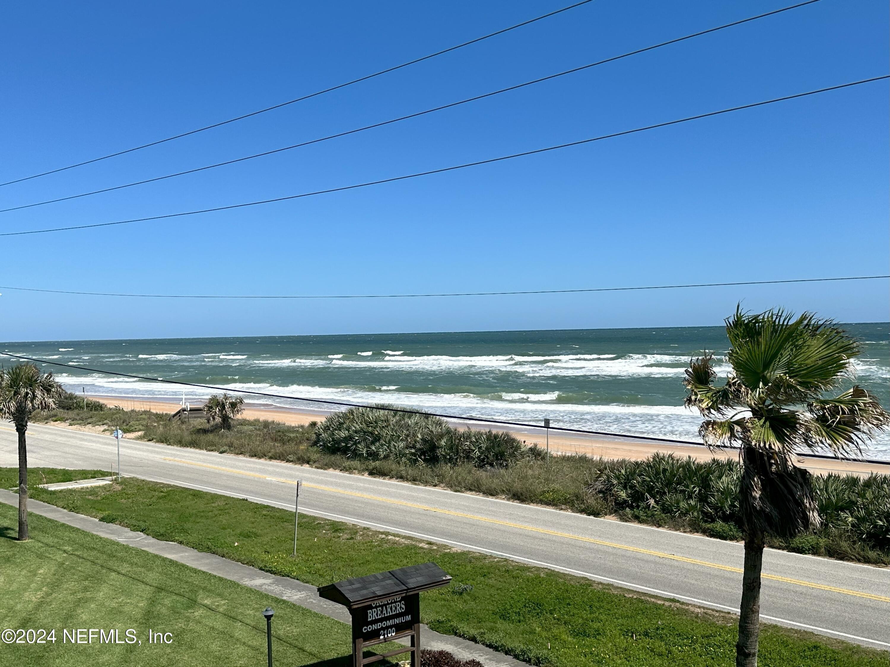 2100 Ocean Shore Boulevard, Unit 3010 Ormond Beach, FL 32176 - Photo 32 of 32 a view of an ocean and a yard