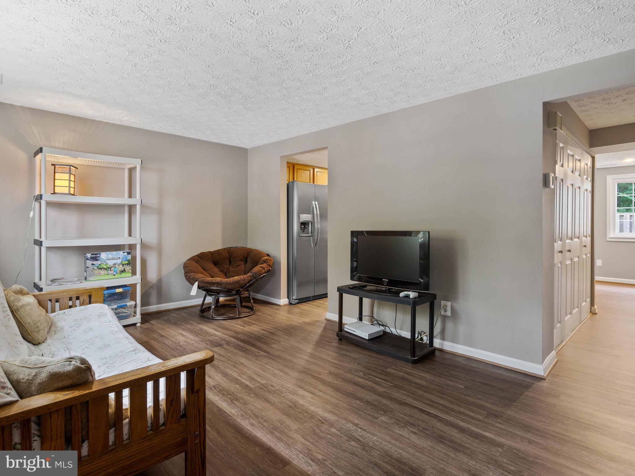 8297 Bark Tree Court Springfield, VA 22153 - Photo 2 of 26 Check out the pristine engineered wood flooring.