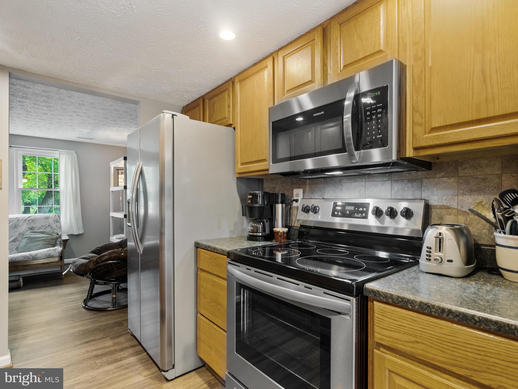 8297 Bark Tree Court Springfield, VA 22153 - Photo 6 of 26 Beautiful kitchen with stainless steel appliances.