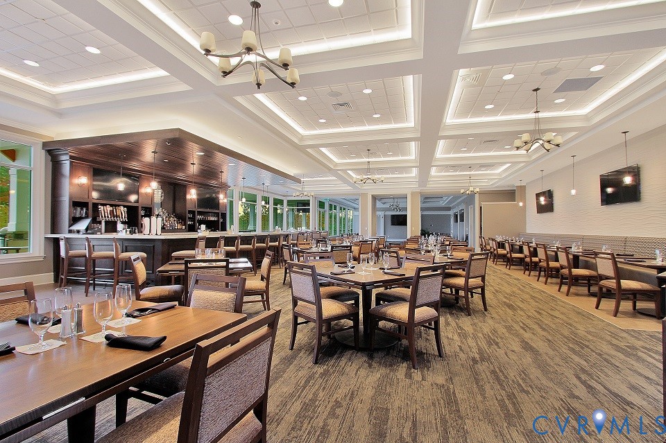 18771 Palisades Ridge Moseley, VA 23120 - Photo 33 of 35 a room with lots of wooden furniture a large window and furniture