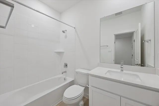 a bathroom with a sink a toilet and a bathtub