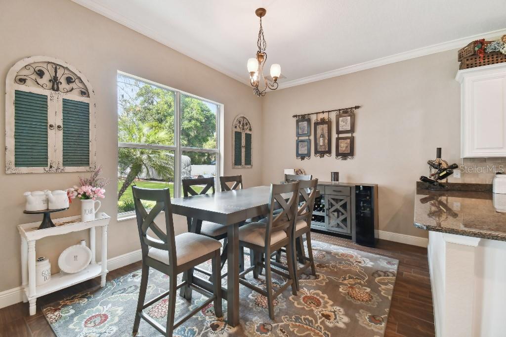 849 John Cressler Drive Seffner, FL 33584 - Photo 15 of 45 a view of a dining room with furniture window and outside view