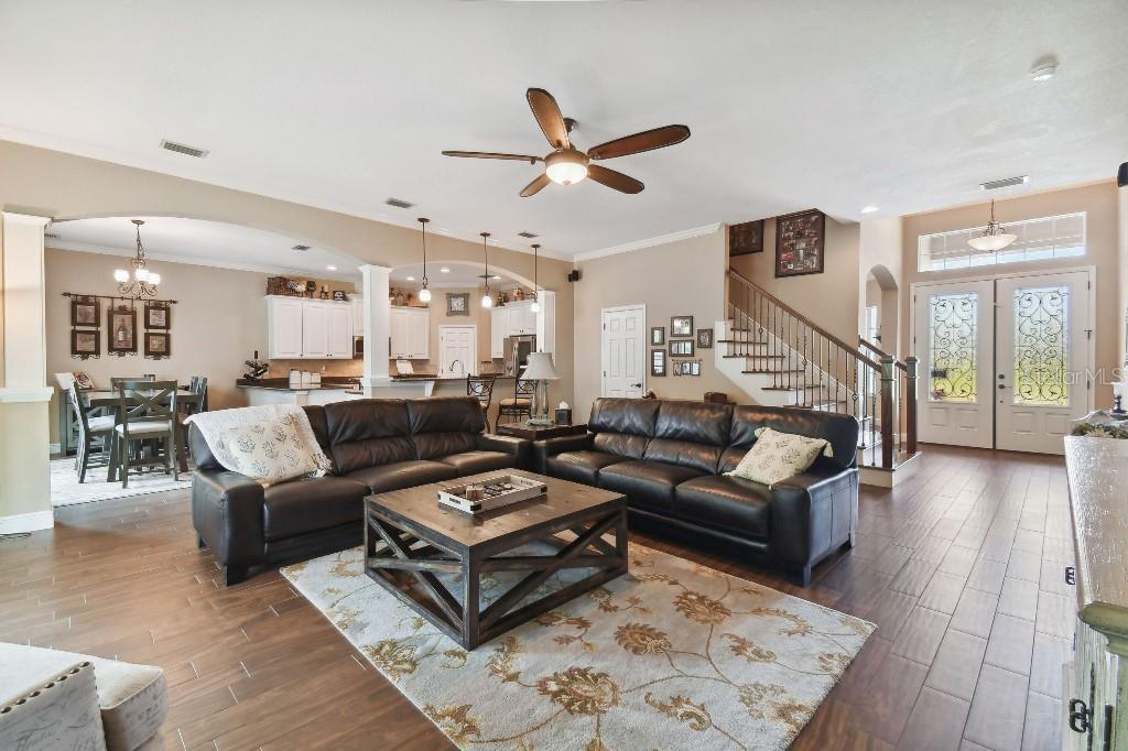 849 John Cressler Drive Seffner, FL 33584 - Photo 16 of 45 a living room with furniture and wooden floor
