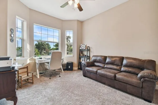 a living room with furniture and a window