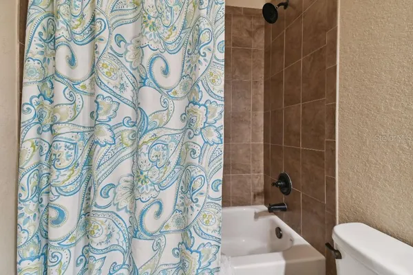 a bathroom with a sink and toilet