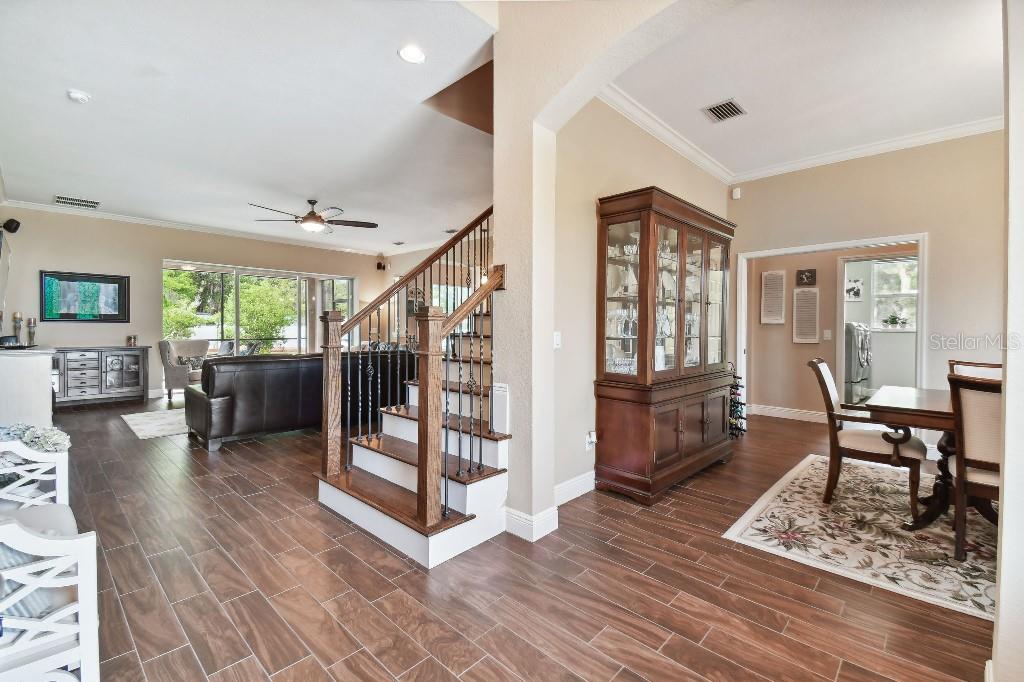 849 John Cressler Drive Seffner, FL 33584 - Photo 6 of 45 a living room with furniture and a wooden floor