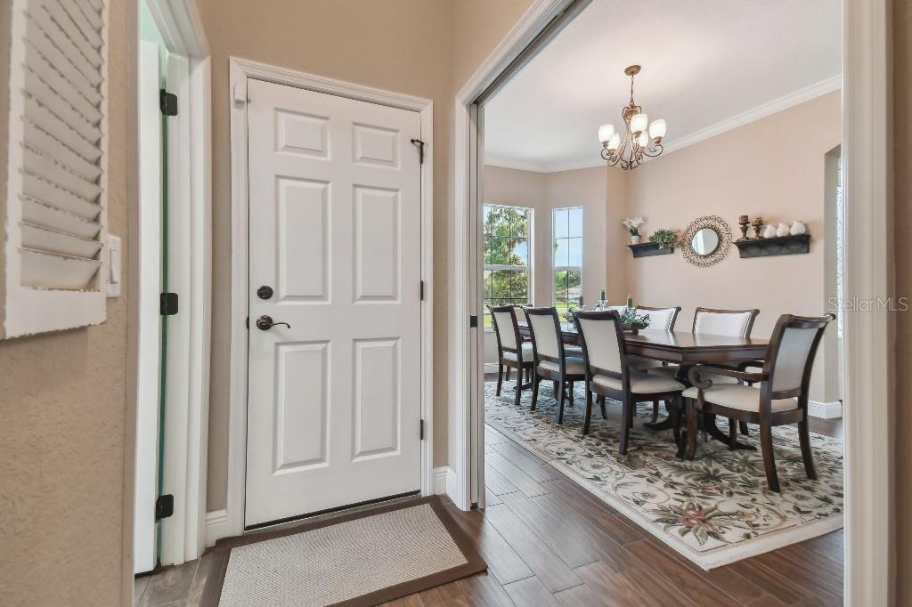 849 John Cressler Drive Seffner, FL 33584 - Photo 8 of 45 a view of a dining room with furniture and chandelier