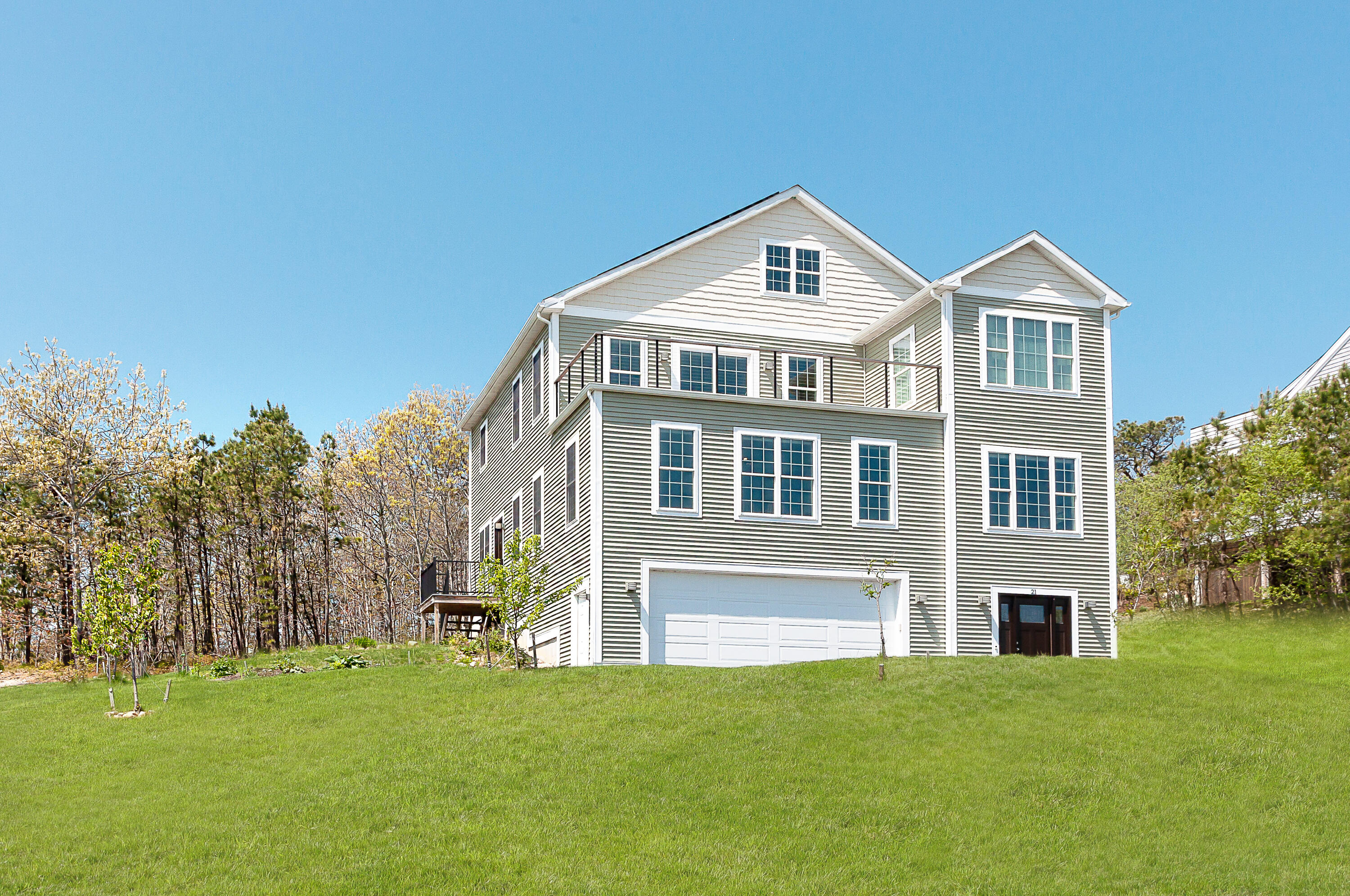a front view of a house with a yard