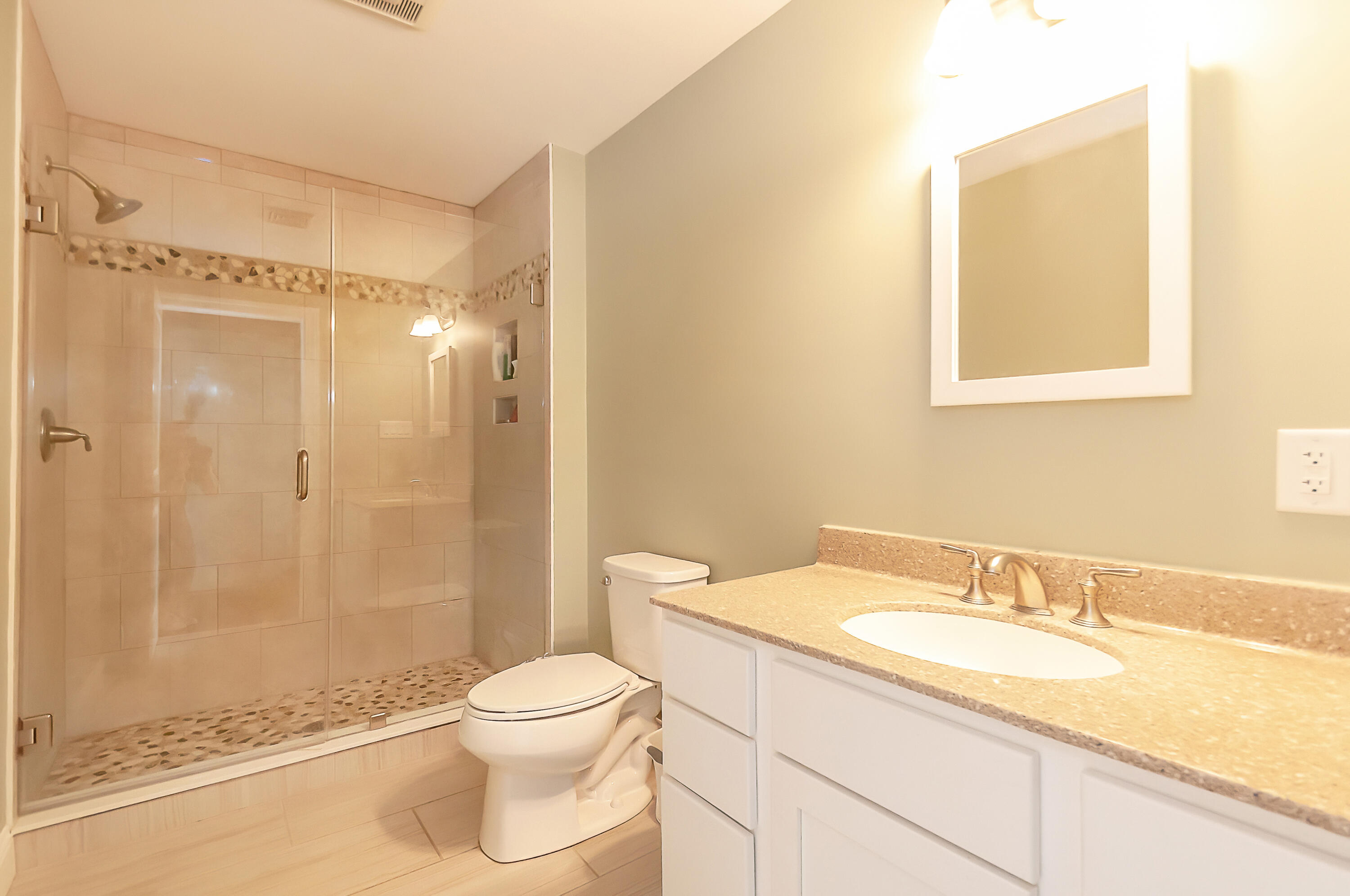 21 Sheppard Road Sagamore Beach, MA 02562 - Photo 21 of 33 a bathroom with a granite countertop sink toilet and shower