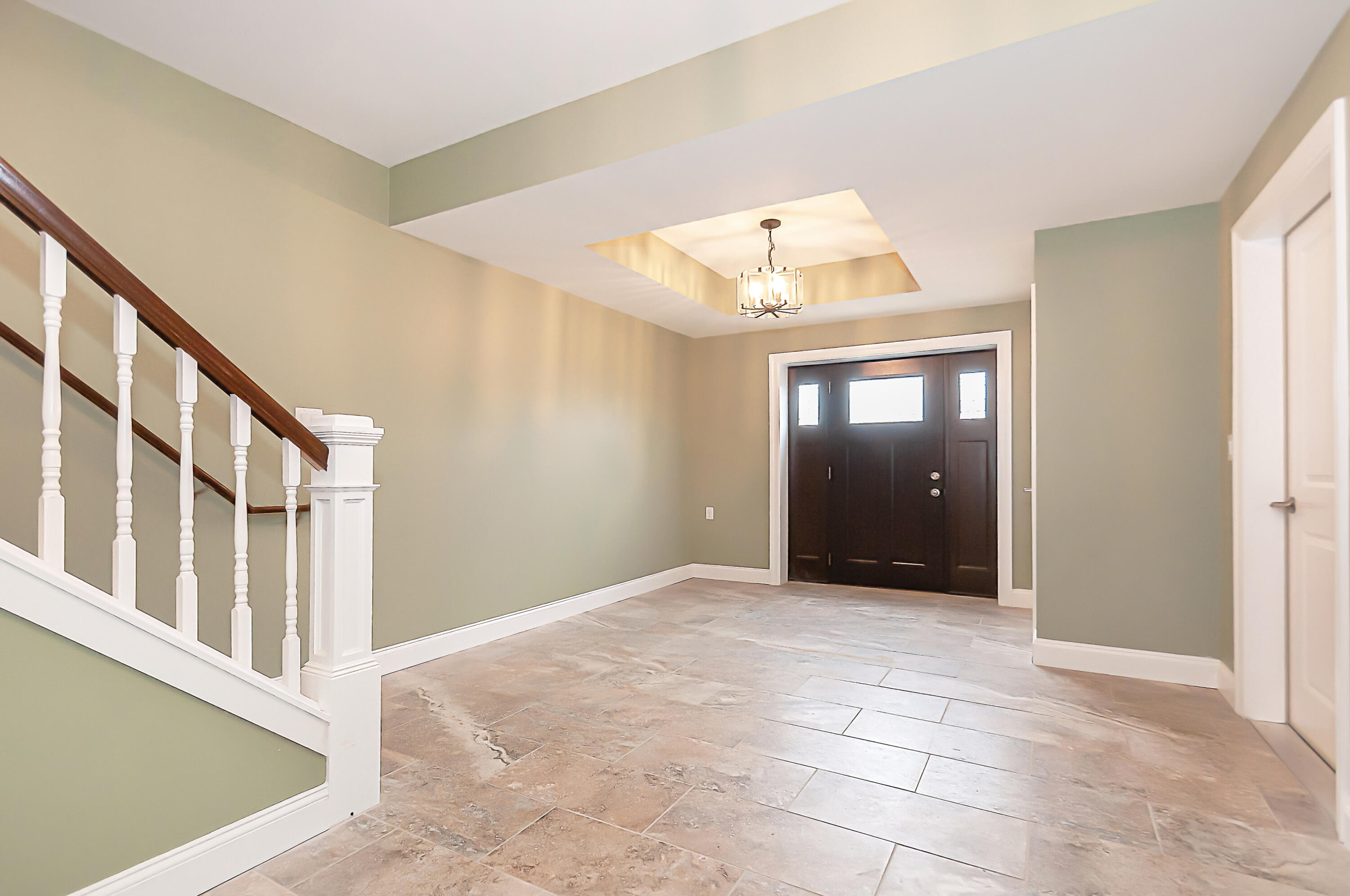 21 Sheppard Road Sagamore Beach, MA 02562 - Photo 6 of 33 a view of a hallway with an entryway and a living room