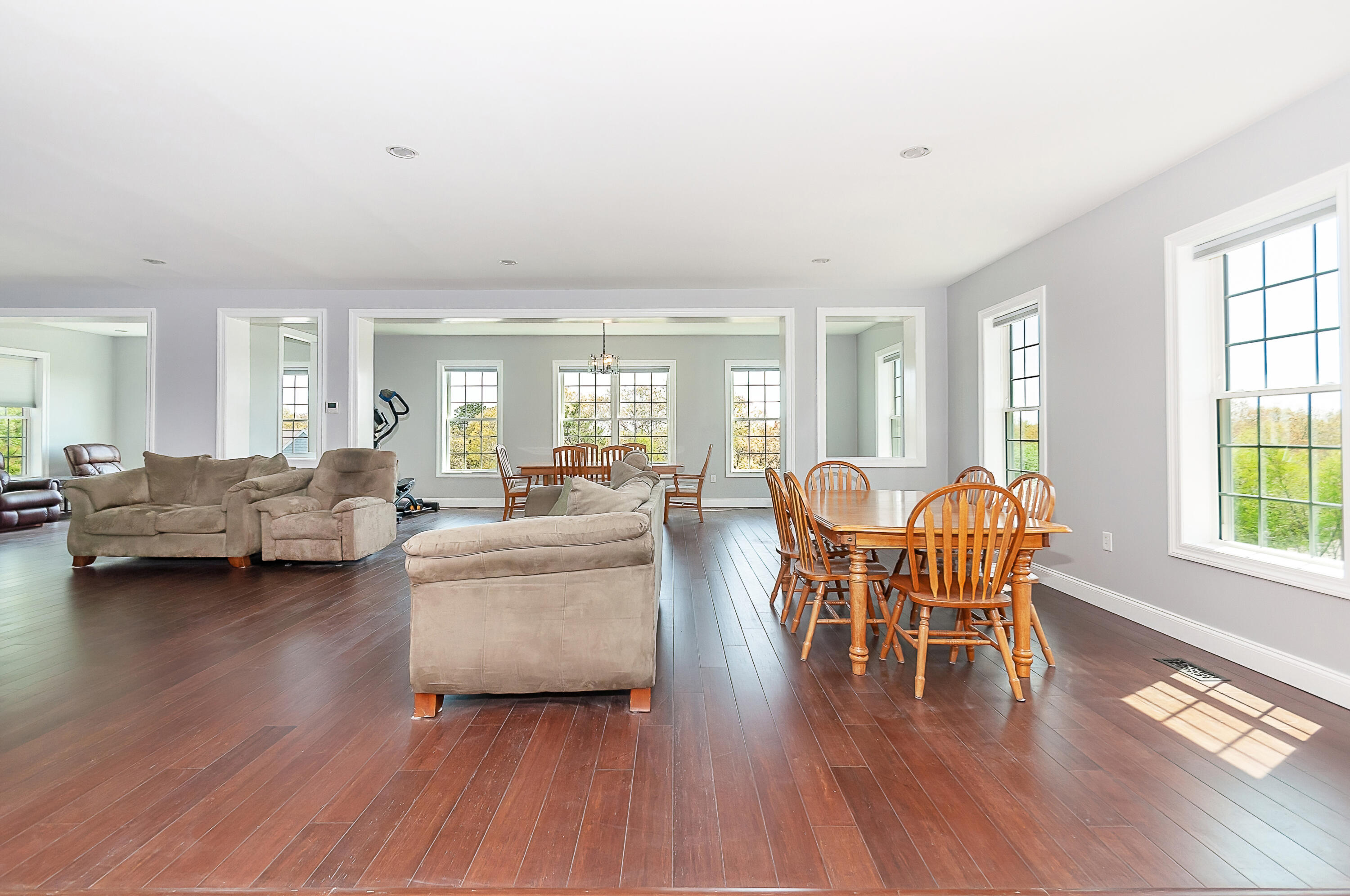 21 Sheppard Road Sagamore Beach, MA 02562 - Photo 9 of 33 a living room with furniture and a wooden floor