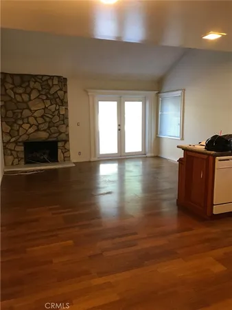 a view of a fireplace with wooden floor