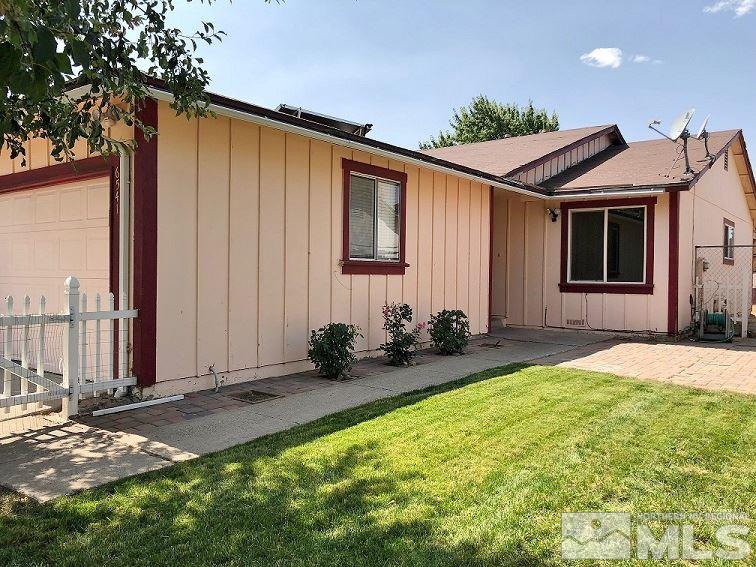 6541 Flower Street Reno, NV 89506 - Photo 1 of 14 a backyard of a house with yard and outdoor seating