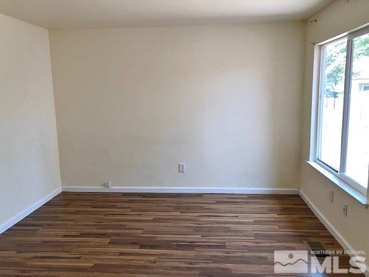 6541 Flower Street Reno, NV 89506 - Photo 2 of 14 a view of room with window and wooden floor